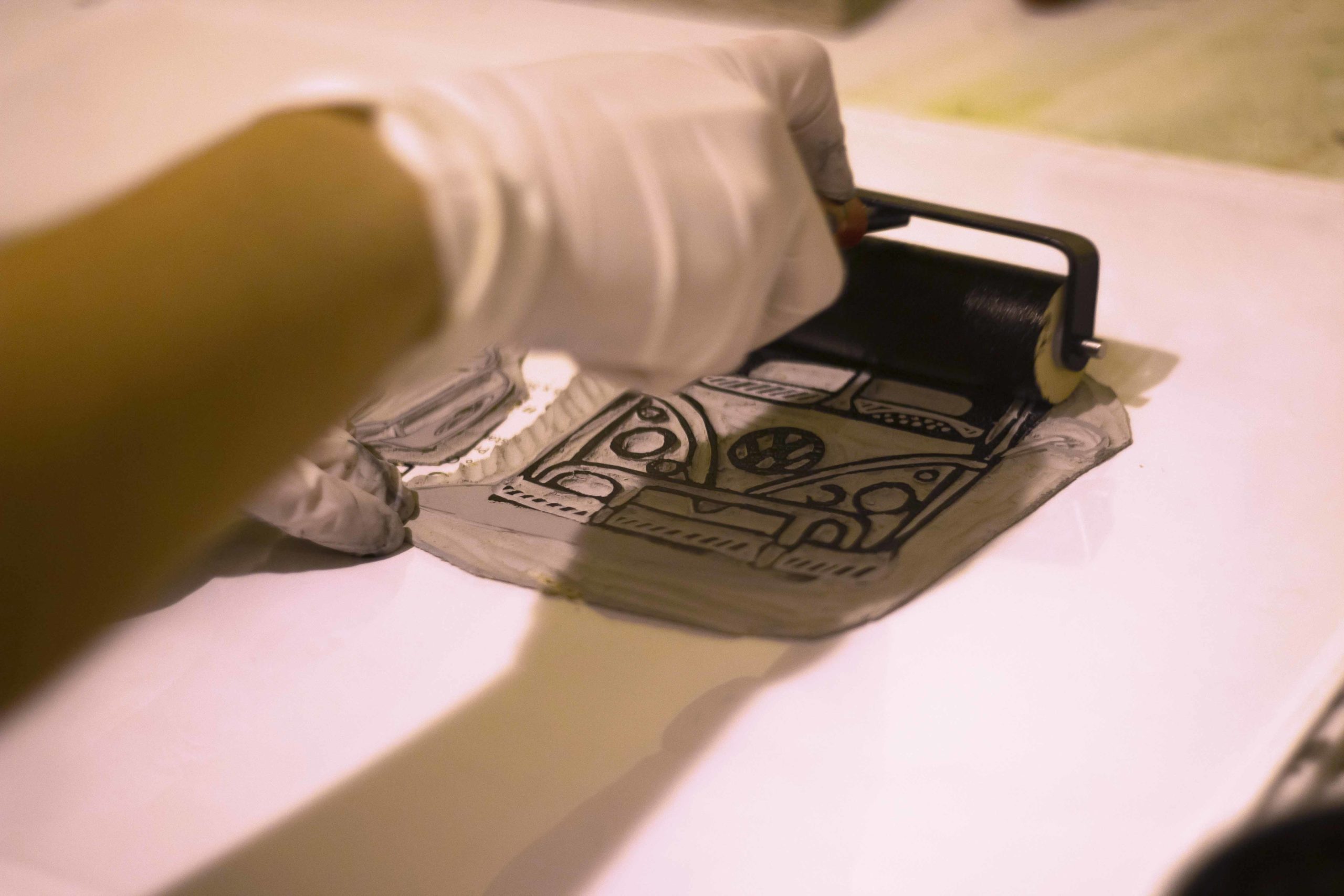 rolling ink on to a linoleum block