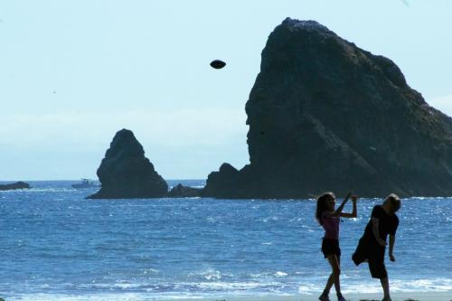 kids play football on the beach